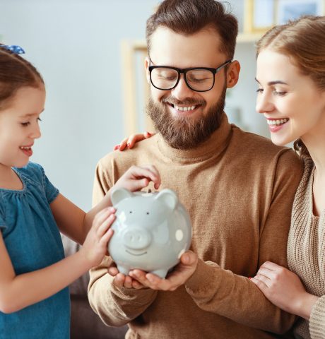 family savings, budget planning, children's pocket money. family with piggy Bank moneybox